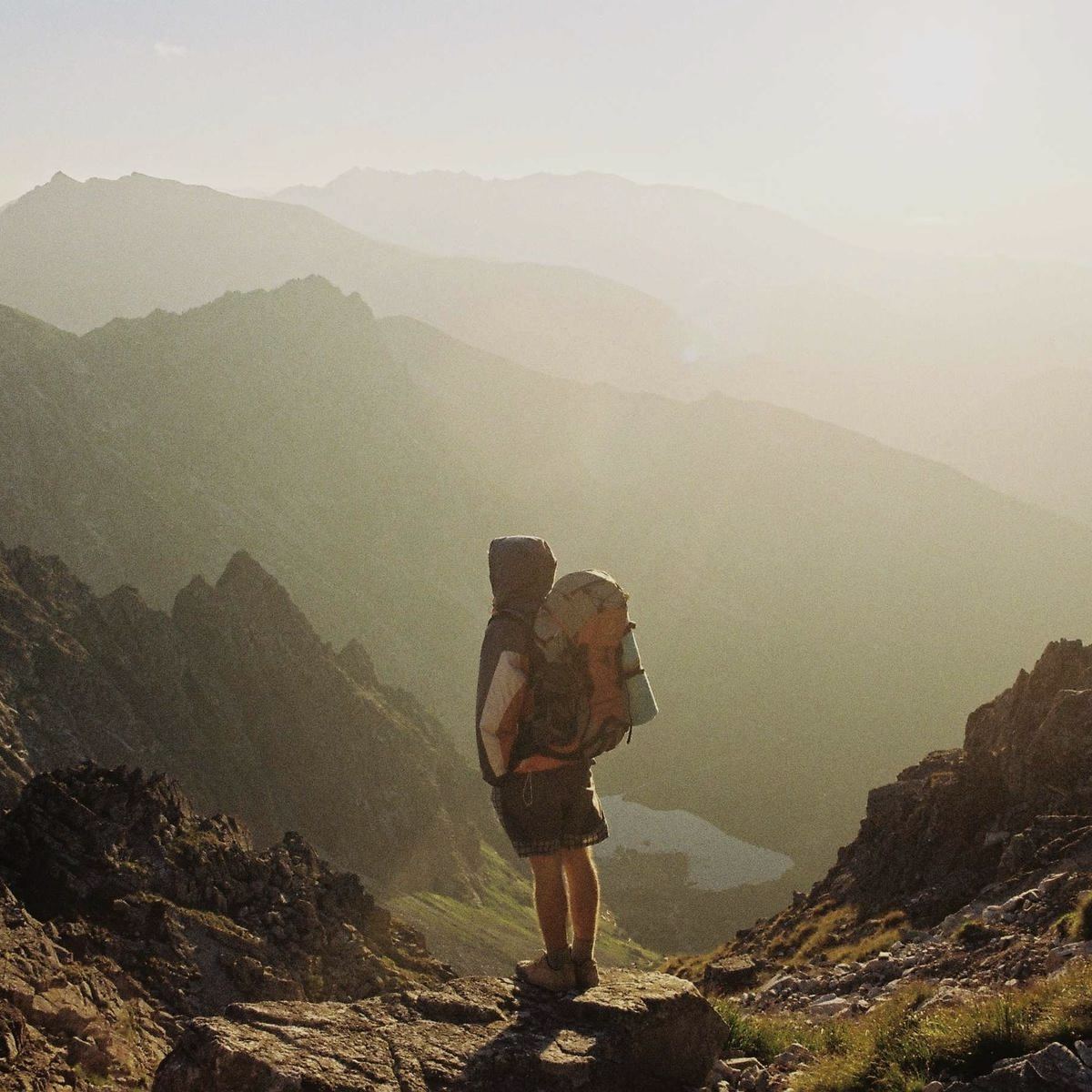 A walker on a misty mountain path